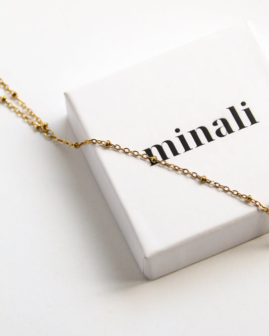 Ember Handchain in gold
